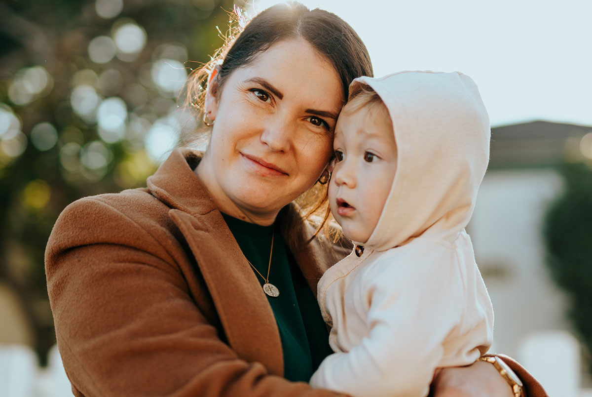 Woman holding young child