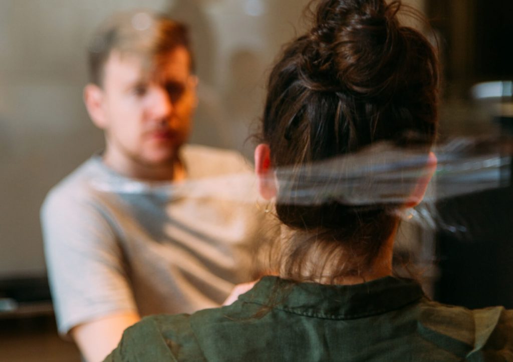 Man and woman speaking together.