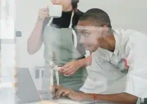 Two people working together.