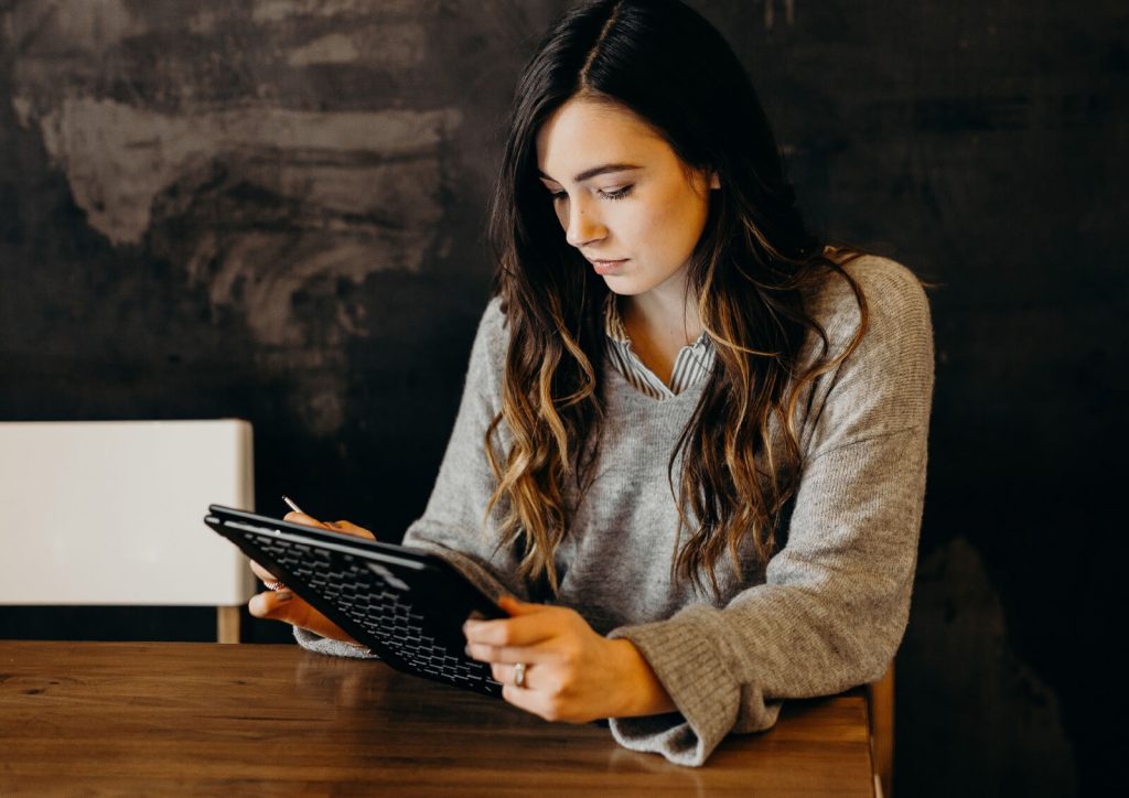 Person working on a tablet device.