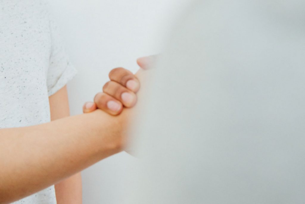 Two people holding hands.