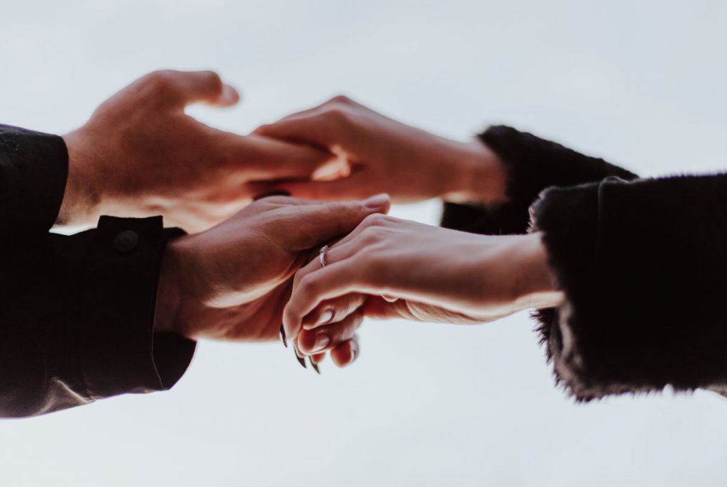 Two people holding hands.