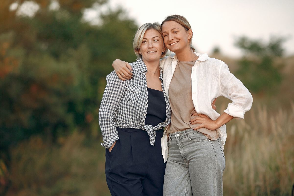 Mum and teenager daughter smiling for photo