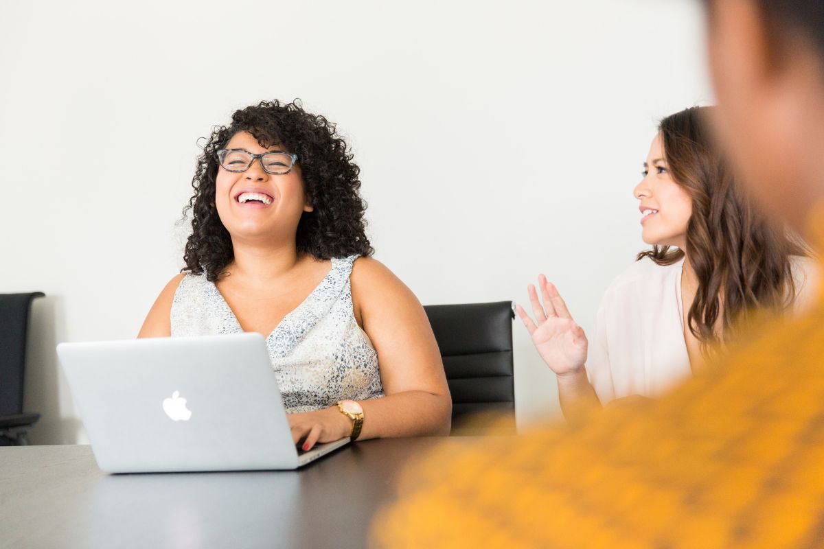 Two professional women working on laptop