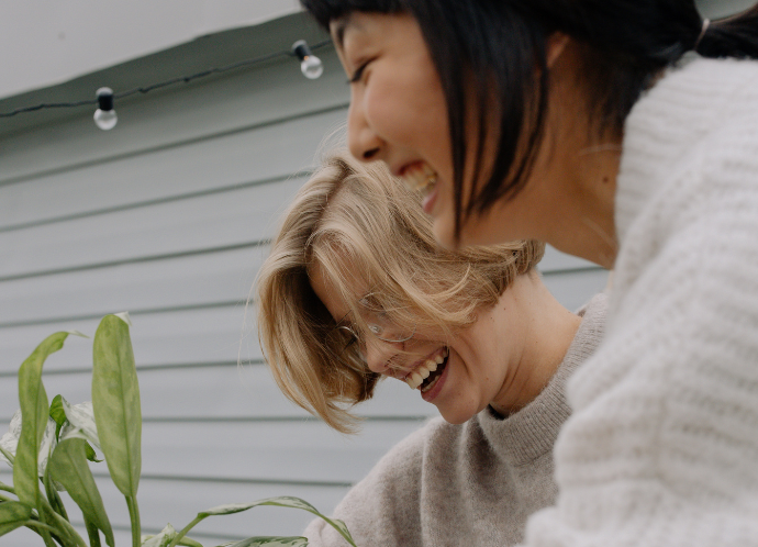 Two women smiling 