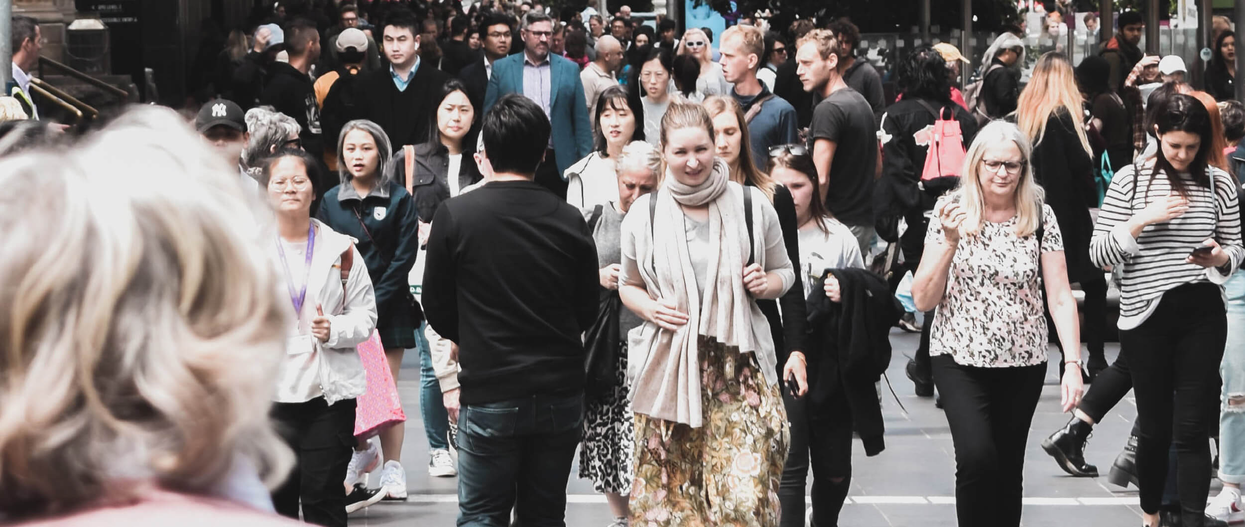 Many people walking in the city.