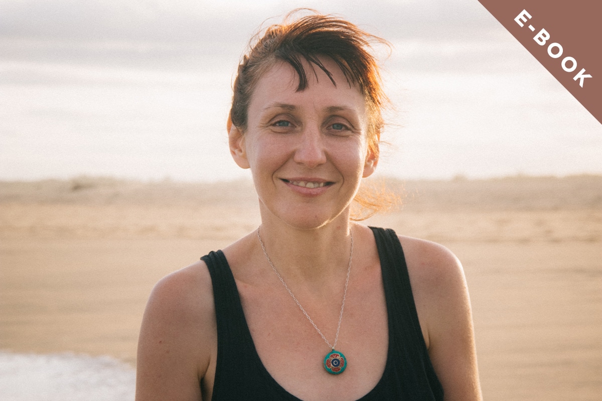 Woman on the beach smiling