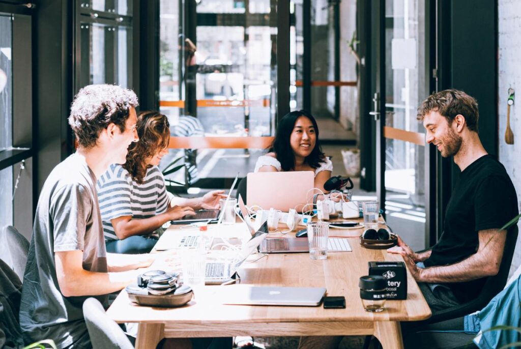 Group of colleagues working at table together