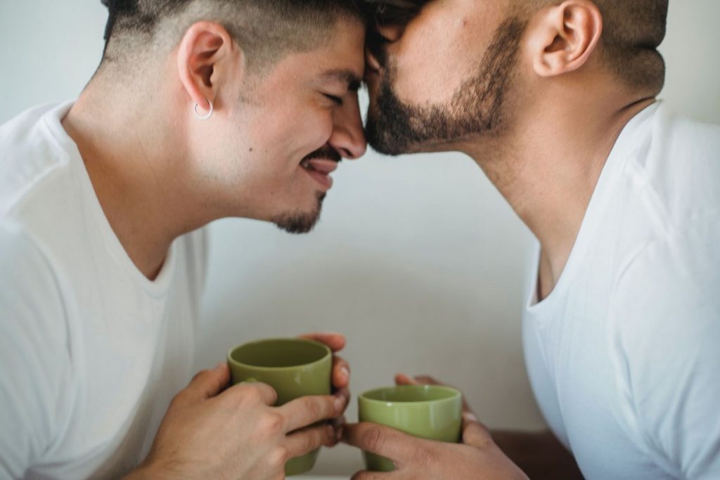 Man kissing his partner on the forehead