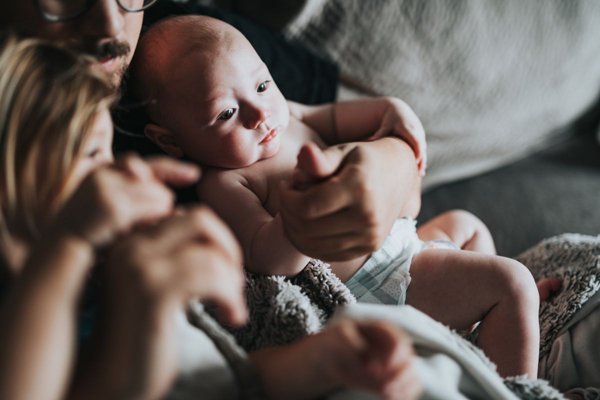 New dad with a baby on his lap