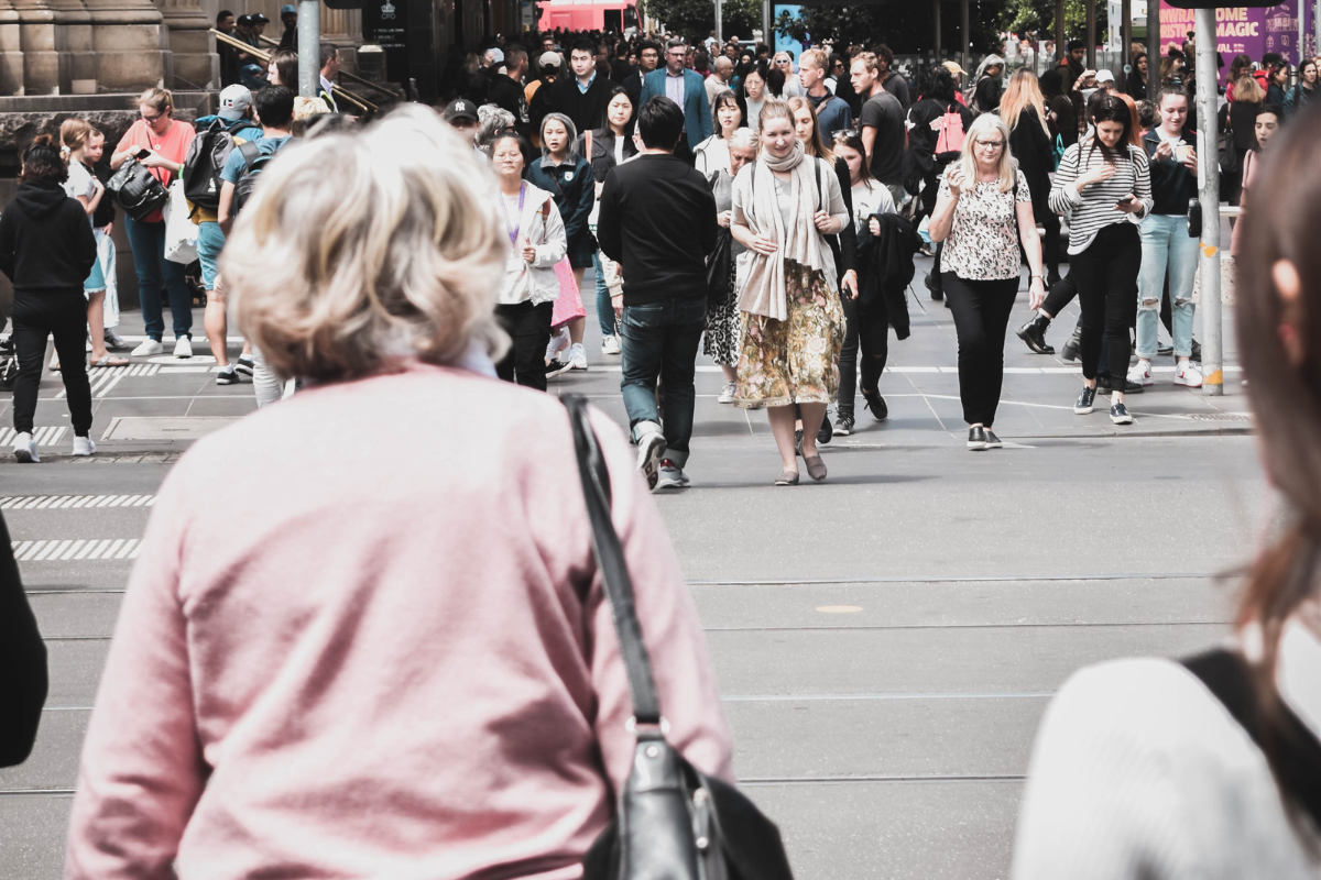 People crossing the road on busy city street