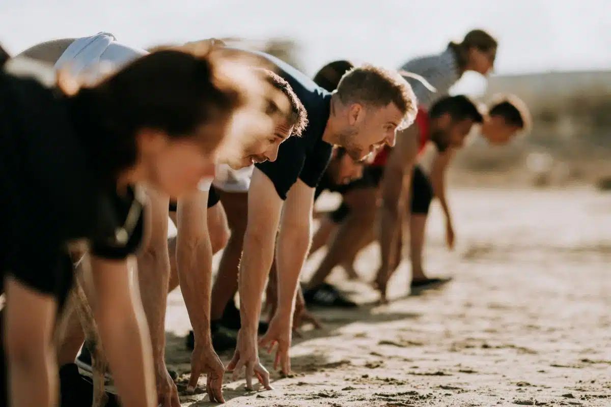 Group of people at start line for race on a beach