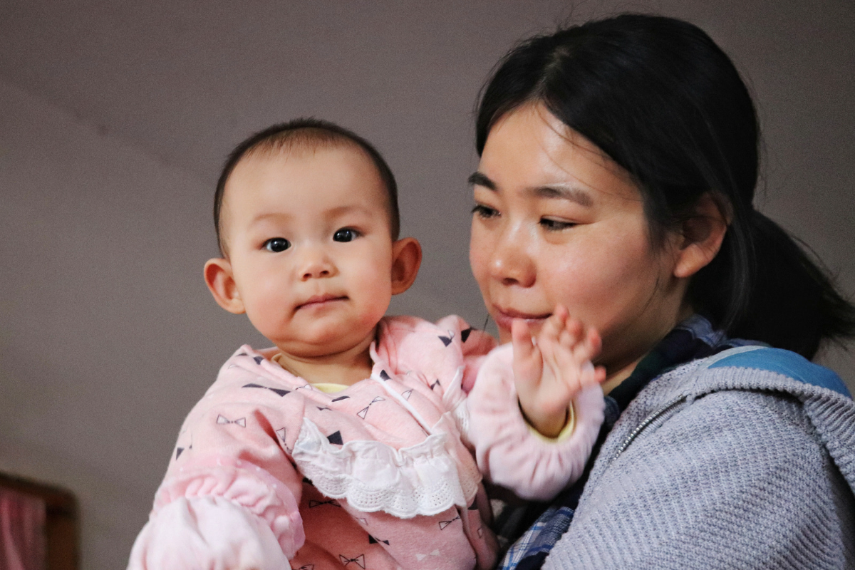 Mother holding her baby