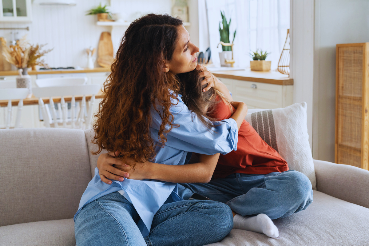 parenting hugging sad child