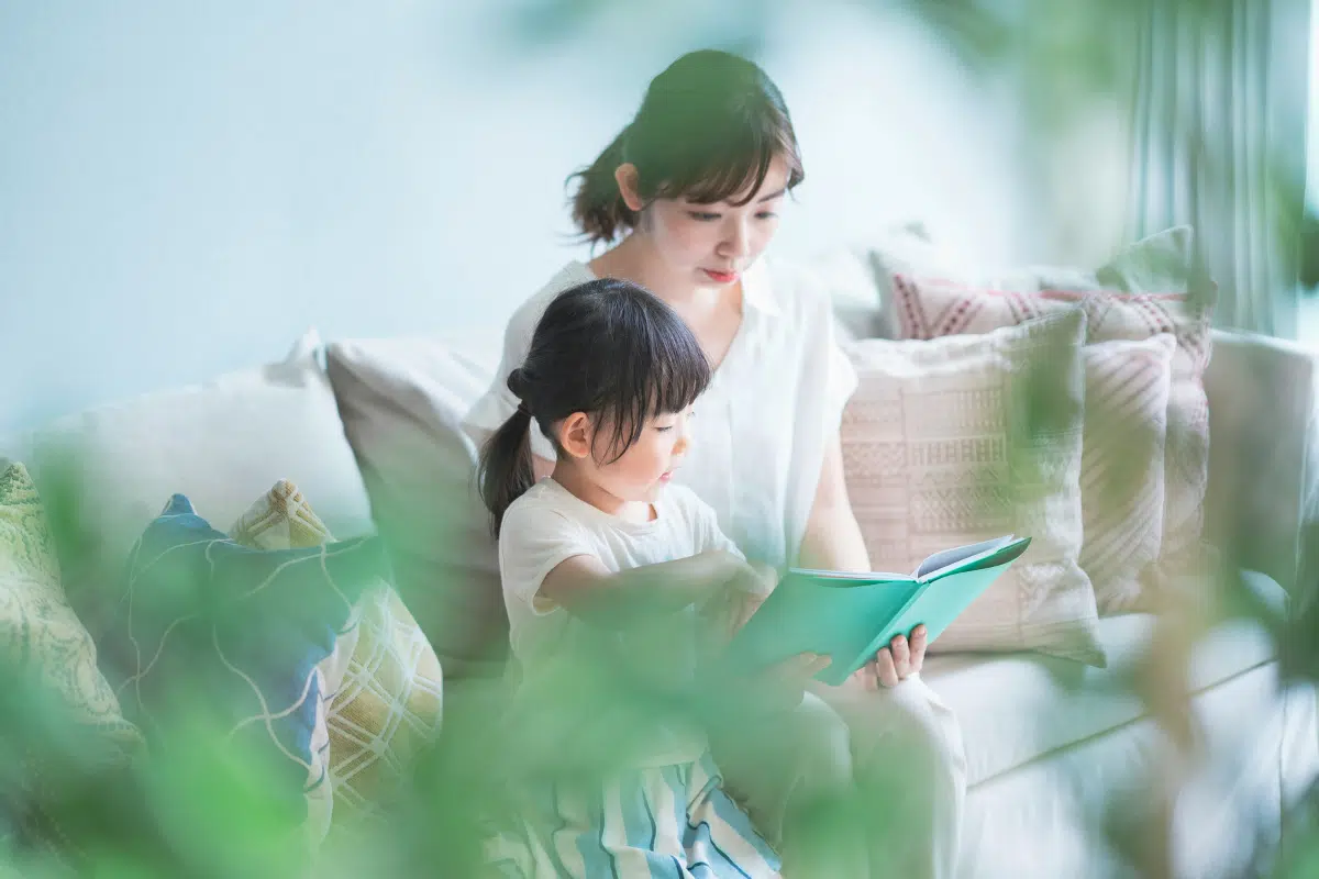 Parent reading book to child
