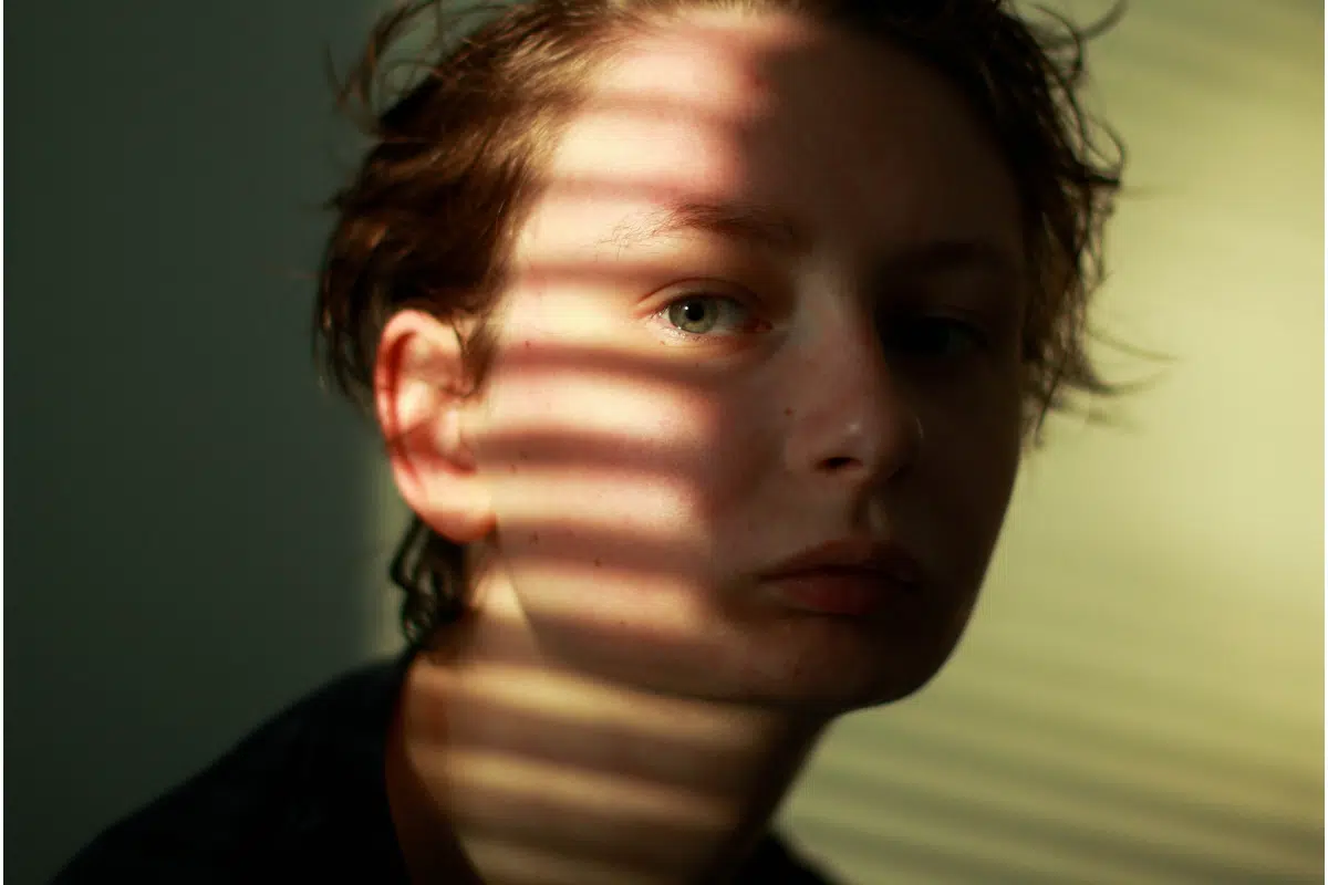 Boy with shadow over his face