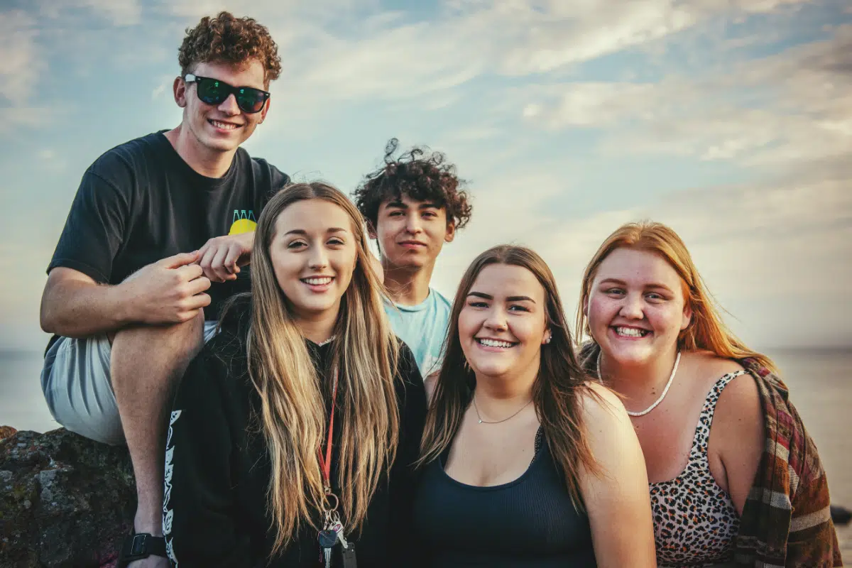 group of teens smiling at the camera